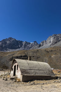 Scenic view of mountains against clear blue sky