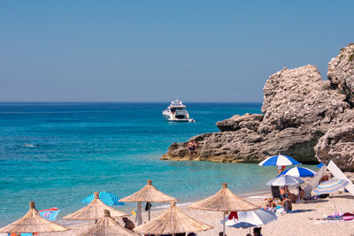 Scenic view of sea against clear blue sky