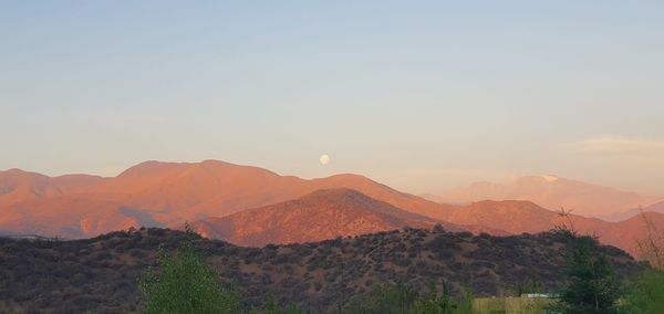 Scenic view of mountains against sky during sunset