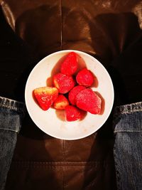 High angle view of strawberries in bowl on table