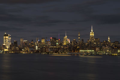Illuminated city buildings at night