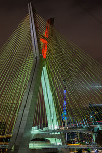 Low angle view of modern building against sky at night