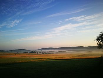 Scenic view of field against sky