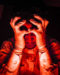 Close-up portrait of young man wearing mask