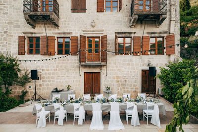 Chairs and tables in front of building