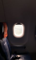 View of man sitting in airplane