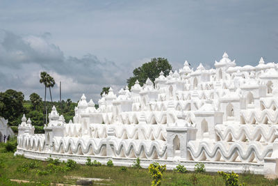 Close-up of limestone pagoda against blue sky