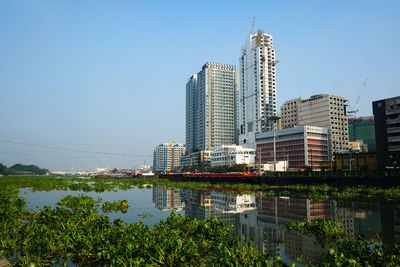 Modern cityscape against clear sky