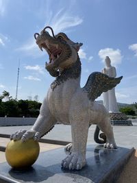 Statue against sky in park