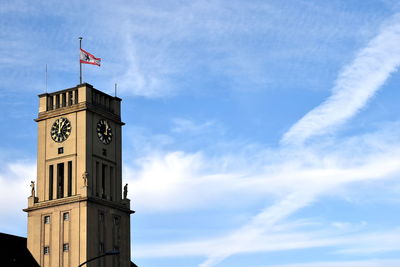 Low angle view of clock tower against sky