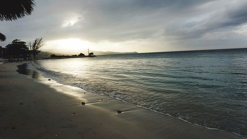 Scenic view of sea against sky at sunset