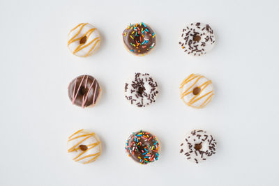 Directly above shot of donuts on white background