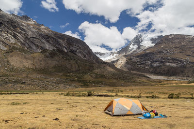 Tent on field against sky