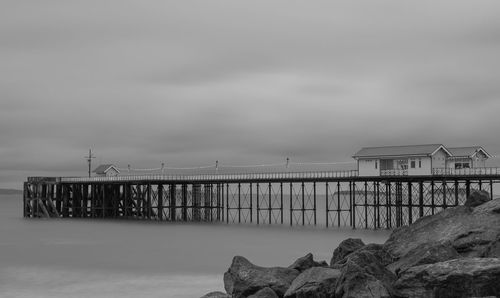 Pier over sea against sky