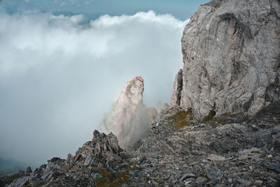 Smoke emitting from volcanic mountain against sky