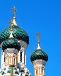 Low angle view of church against blue sky