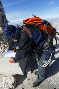 Full length of hiker standing on mountain