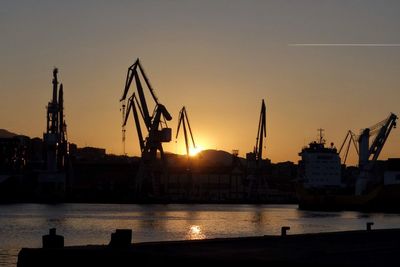 Silhouette of harbor at sunset