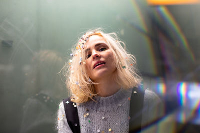 Portrait of woman with confetti in hair