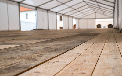 Inside big canvas tent wood floor with white walls