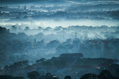 Aerial view of cityscape in fog