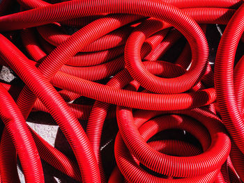 Full frame shot of red plastic pipes