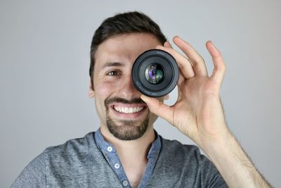 Portrait of man holding navigational compass