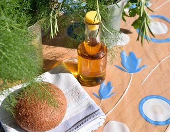 High angle view of bread and oil on table