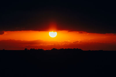 Scenic view of silhouette landscape against romantic sky at sunset