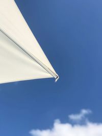 Low angle view of white building against blue sky