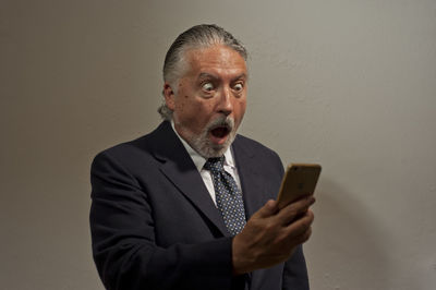 Portrait of man using mobile phone