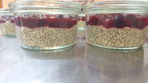 Close-up of fruits in glass jar on table