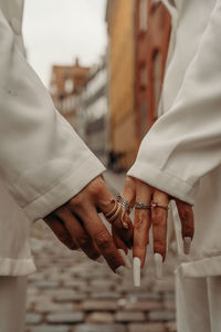  hands holding each other - couple in love