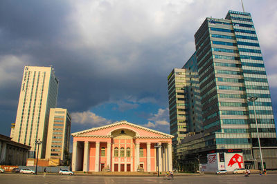 Low angle view of modern buildings against sky in city