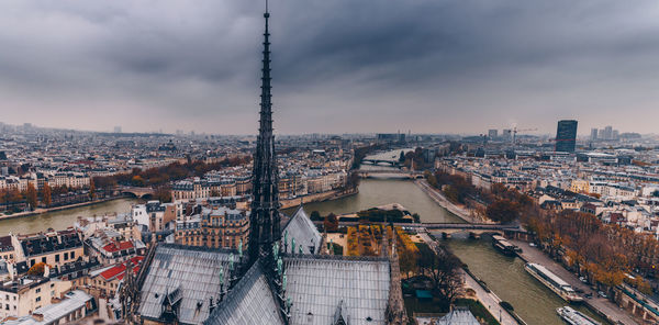 High angle view of city against cloudy sky