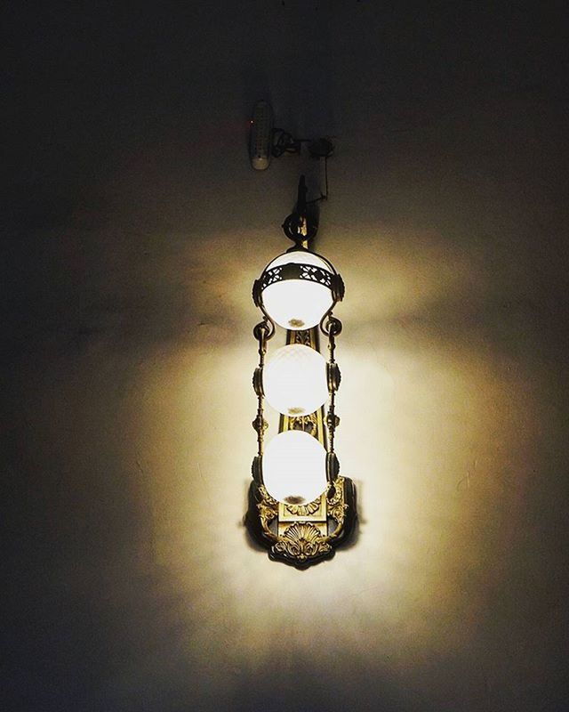 indoors, lighting equipment, illuminated, ceiling, hanging, electricity, electric light, low angle view, chandelier, electric lamp, decoration, light bulb, light fixture, wall - building feature, home interior, glowing, no people, light - natural phenomenon, lamp, single object