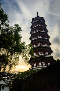 Low angle view of pagoda against sky in city