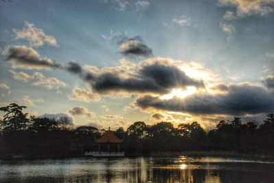 Scenic view of lake against cloudy sky