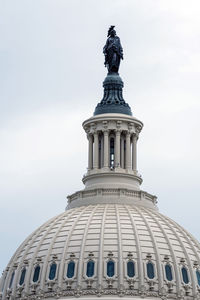 Low angle view of statue of building against sky