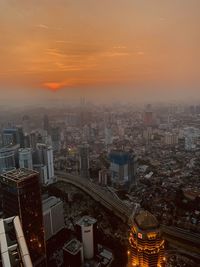 High angle view of buildings against sky during sunset