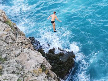 High angle view of man surfing in sea