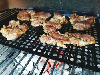 High angle view of meat on barbecue grill