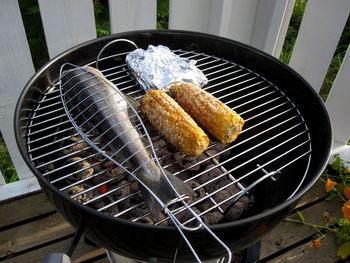 High angle view of meat on barbecue grill