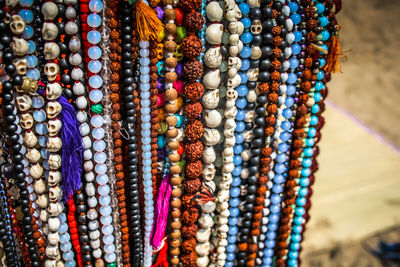 Close-up of multi colored jewelry for sale