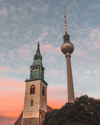 Low angle view of towers against sky