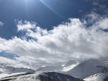 Scenic view of snowcapped mountains against sky