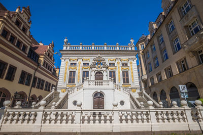 Low angle view of historical building against blue sky