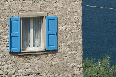 Blue window of old building