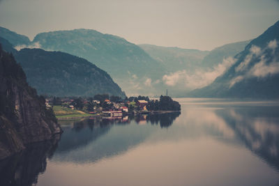 Scenic view of lake and mountains against sky