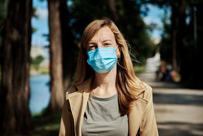 Woman in protective mask at city street